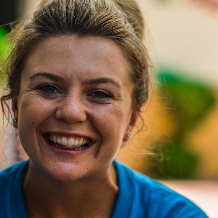 Kaveri Mehta, Lead Design Curator at PepperGardenStudio, reviewing corporate floral arrangements